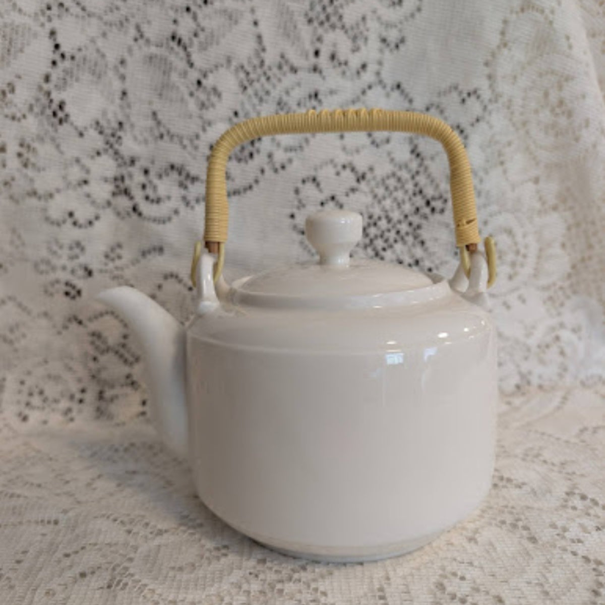 Vintage White Porcelain Teapot with Woven Bamboo Handle