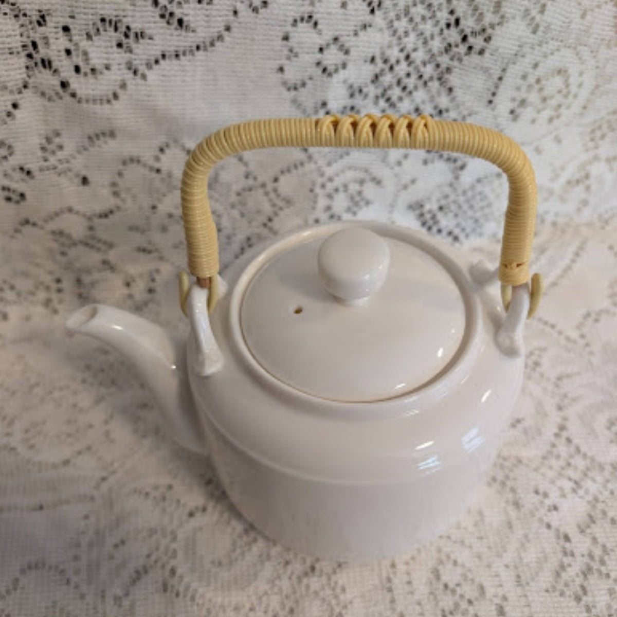 Vintage White Porcelain Teapot with Woven Bamboo Handle